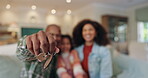 Hand, keys and family in new home for real estate investment, loan or mortgage. Property, mother and father with child moving to dream house closeup with parents show keychain to celebrate relocation