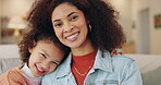 Woman, child and family on sofa for portrait, happiness and embrace in home. Proud single mom, daughter or hug in living room for bonding, relationship growth or support on weekend with trust or love