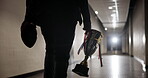 Football player, trophy and champion with ball in stadium for tournament winner, match success or competition. American contact sport, person and professional athlete in cloakroom corridor after game