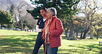 Caregiver, park and senior woman with walking stick in nature for assisted living, retirement and outdoor for fresh air. Female nurse, elderly person and help in garden for recreation and wellbeing.