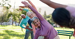 Coach, stretching arms or old people in park for fitness or body mobility in outdoor workout. Group, trainer or friends in warm up together for training, exercise or retirement community in nature
