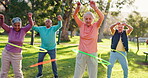 Exercise, elderly people and hoop in park for fitness, core development and wellness. Senior care, retirement group and plastic ring in nature for movement, workout and healthy body in sport class