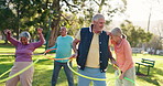 Senior people, exercise and park with hula hoop for class, fun workout or elderly care in fitness. Happy or mature group talking with toy for movement, balance or funny acitivity together in nature