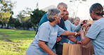 People, volunteer and food parcel in park with teamwork, collaboration and outreach program. Team building, outdoor and community service or work for charity, NGO and donation for poverty in New York