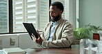 Businessman, tablet and reading in office for communication, news article or information in company. Black male person, tech and connection with positive, concentration and scroll on website or app