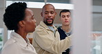 Business people, glass wall and teamwork with tablet, conversation and research for film production. Group, employees and brainstorming with technology, ideas or creativity with story development