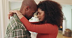 Couple, forehead touch and hug with love for relationship loyalty, support and trust for security. Interracial marriage, man and woman with slow dancing in home for bonding, embrace and affection