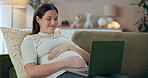 Laptop, hand on stomach and pregnant woman relax with streaming, movies or film on home sofa. Pregnancy, research and mom with internet search, prenatal website or social media app motherhood advice