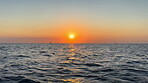 Horizon, water and sky at beach with sunset for travel location, tropical island and holiday destination. Aerial, ripples and tide waves in Zanzibar for summer vacation, ocean scenery and environment