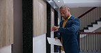 Waiting, documents and businessman by elevator in office late for corporate business proposal presentation. Paperwork, stress and male financial advisor checking time for finance meeting at workplace