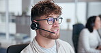 Call center, help and man with headset in office for customer service, online advice or telemarketing. Talking, contact us and consultant in discussion for communication, assistance or tech support 