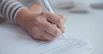 Person, hands and signature on paperwork in office for professional agreement, license and financial terms. Closeup, author and document for initial on publishing contract and manuscript deadline.