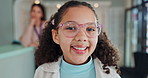 Child, optometry and glasses for eye care, medical professional and consultation with optometrist. Female person, spectacles and specialist in clinic or ophthalmology center for size, frame and lens