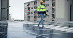 Man, engineer and solar panel in city building for green energy, electricity and sustainability. Male person, electrician and technician in rooftop for inspection, installation and maintenance