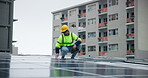 Man, engineer and solar panel with installation in rooftop in city building for green energy, electricity and sustainability. Male person, electrician and technician with inspection for  maintenance