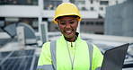 Laptop, sustainable and engineer by solar panels for eco friendly or renewable energy planning. Smile, computer and portrait of African PV installer on rooftop with photovoltaic electricity cells.