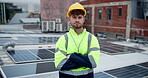 Man, electrician and solar panel with arms crossed in rooftop with pride for green energy or electricity. Portrait, technician and engineer in confidence for installation, maintenance and sustainable