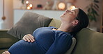 Pregnant, breathing and woman rest on sofa for wellness, maternity health and mother in home. Pregnancy, parenting and person touch tummy for comfort, love and care for motherhood in living room