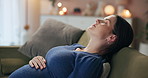 Pregnant, breathing and woman relax on sofa for wellness, maternity health and mother in home. Pregnancy, parenting and person touch tummy for comfort, love and care for motherhood in living room