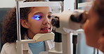 Optometry, healthcare and eye exam with child and consulting for vision, medical and glaucoma check. Slit lamp, light and checkup with face of patient and equipment for wellness and ophthalmology