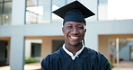 Happy black man, graduation and hat with confidence at university for education, learning or milestone at campus. Portrait of young African, male person or graduate and student with smile for future