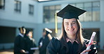 Happy woman, student and graduation with degree at university for education, learning or qualification at campus. Portrait of young female person or graduate with smile for certificate or scholarship