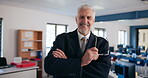 Mature man, education and arms crossed in classroom as teacher for IT subject in high school. Male person, portrait and smile or happy in confidence for teaching, learning and support with pride