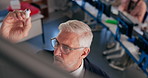 Professor, man and writing on board for education, curriculum and learning in top view. Mature lecturer, talk and teaching in university with students on computer for IT, software and coding lesson
