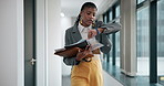 Black woman, walking and watch with documents for deadline, rush or schedule in office building. Young African or stressed business employee checking time on wristwatch with paperwork at workplace