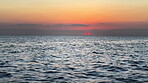 Horizon, waves and sky at beach with sunset for travel location, tropical island and holiday destination. Aerial, ripples and tide water in Zanzibar for summer vacation, ocean scenery and environment