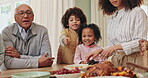 Family, thanksgiving and food with children, pointing and table for reunion, celebration and holiday. Social gathering, people and happy for gratitude and brunch with gourmet meal, event and feast