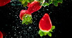 Strawberry, water and hydration with natural fruit for vitamin c, fresh produce or wash on a black background. Closeup of organic food, juicy or sweet nutrition with splash for healthy diet or fiber