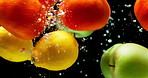 Natural fruit, water and mix with vitamin c for fresh produce, hydration or wash on a black background. Closeup of juicy, organic food or citric acid in wet splash for healthy diet or nutrition