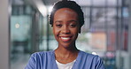 Portrait, black woman and happy nurse in clinic for healthcare service, wellness or job pride in Kenya. Face, confident and African medical surgeon laugh for expert experience of worker in hospital