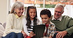 Happy, grandparents and children with tablet on couch for streaming videos, entertainment and digital activity together. Elderly people, kids and laughing in family home for online social media joke.