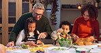 Cooking, family and kids help parents with dinner for thanksgiving in home. Children, mom and dad prepare  turkey meal, food and chopping healthy organic vegetables with interracial people in kitchen