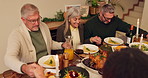 Praying, family and dining room with food, smile and feast for thanksgiving, people and faith in God. Home, holding hands and happy grandparents with son, worship or gathering for reunion with turkey