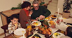 Laugh, happy family and eating dinner for thanksgiving celebration in home. Children, mom and dad share meal, serving and funny conversation or comedy with interracial people bonding together above