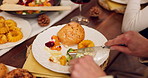 Food, plate and hands at dinner party, celebration or thanksgiving feast with people. Table, catering and dining room with family reunion, gathering and meal with gourmet cooking menu at event 