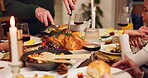 Thanksgiving, hands and cutting turkey for dinner, celebration and reunion. People, family and meal with food for gathering at home with love, support and unity for care in dining table with chicken