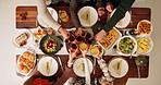 Above, family and cheers on dinner for thanksgiving celebration and reunion with wine glass. People food and chicken on table at home to feast with unity, support and care with gathering at home