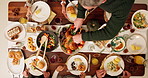 Dining table, food and family at thanksgiving dinner with gourmet chicken, vegetables and juice. Meal, buffet and people at festive event or party celebration for dinner, lunch or supper from above.