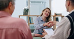 Happy business woman, handshake and partnership in hiring, meeting or b2b together at office. Group of employees shaking hands, promotion or celebration for interview, deal or recruiting at workplace