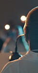 Conference, audience and woman with microphone at podium for development, seminar and communication. International, presenter back and public speaking at summit for global trade, governance or update