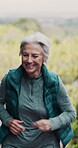 Senior woman, running and talking for retirement, wellness and cardio training outdoor as fitness. Elderly person, runner and conversation for workout, exercise or mental health in nature as vertical