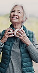 Elderly woman, headphones and phone for fitness, retirement and cardio health outdoor while running. Senior person, mobile and music app for streaming, exercise and podcast in nature as vertical