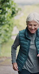 Senior couple, running and talking for retirement, wellness and cardio training outdoor as fitness. Elderly people, happy and conversation for workout, exercise or mental health in nature as vertical