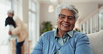 Face, senior woman and happy on sofa with wellness for thinking, reflection and relax in family home. Elderly person, portrait smile and contemplating on couch for perspective, calm and retirement