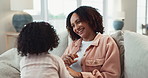 Happy, playing and mom with child on sofa for bonding, love and playful relationship in living room. Family home, childhood and mother with young girl for laughing, fun and relax on weekend together
