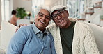Senior, couple and face with hug on sofa in home with bonding, laughing and commitment in marriage. Elderly love, people and portrait in happy relationship with talking, care or relax with retirement